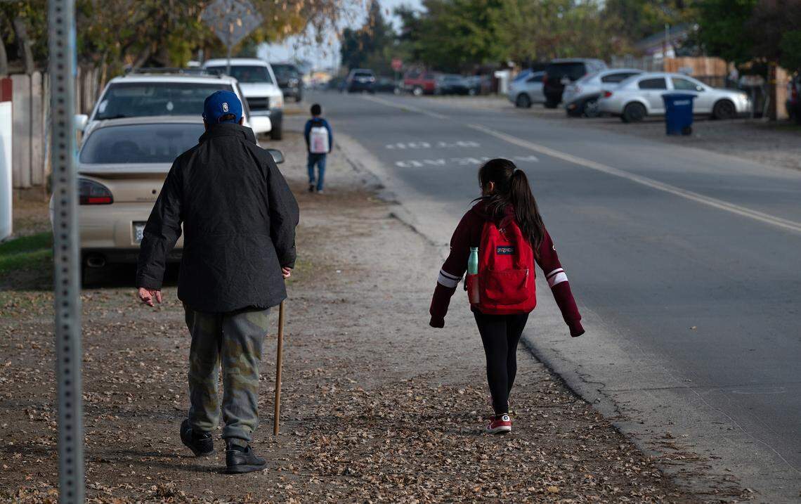 Students walk home from Bret Harte Elementary School along Glenn Avenue in Modesto, Calif., Thursday, Dec. 8, 2022.