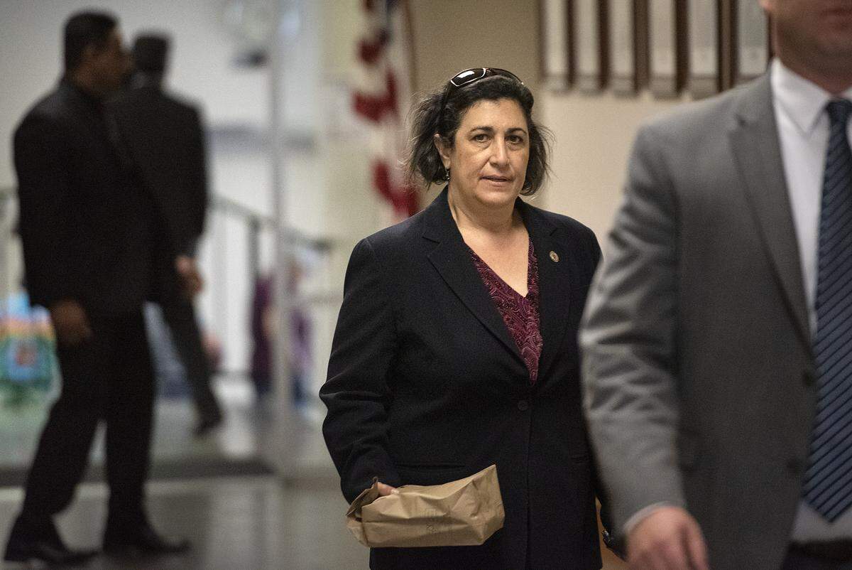 Stanislaus County Chief Deputy District Attorney Marlisa Ferreira arrives at the Stanislaus County Superior Courthouse with his lawyer in Modesto, Calif., Friday, June 14, 2019.