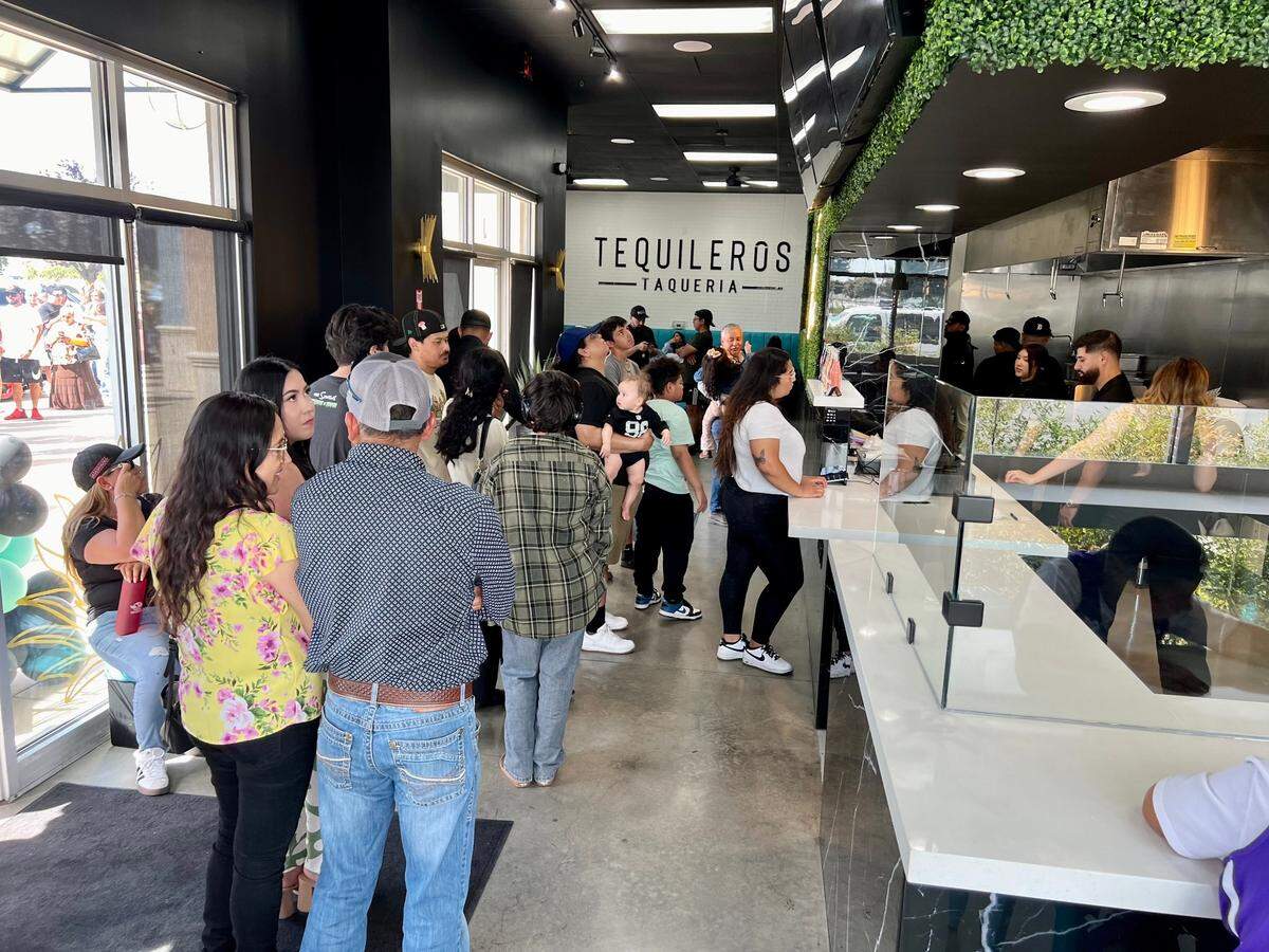 Customers lined up to get a first taste of Taquileros Taqueria during its grand opening Sunday, Sept. 15, 2024, in Salida, Calif.