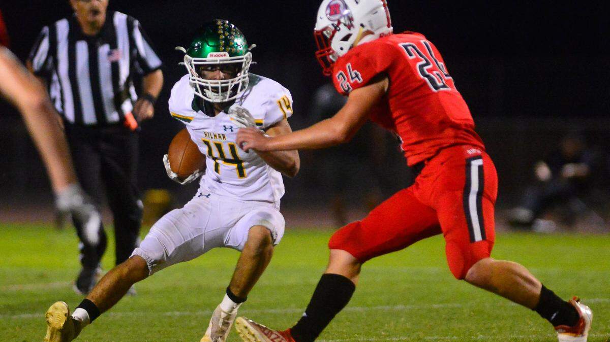 Hillmar running back Luis Vargas jukes a Ripon defender during a football game between Hilmar and Ripon High School at Ripon High School in Ripon CA on September 24, 2021