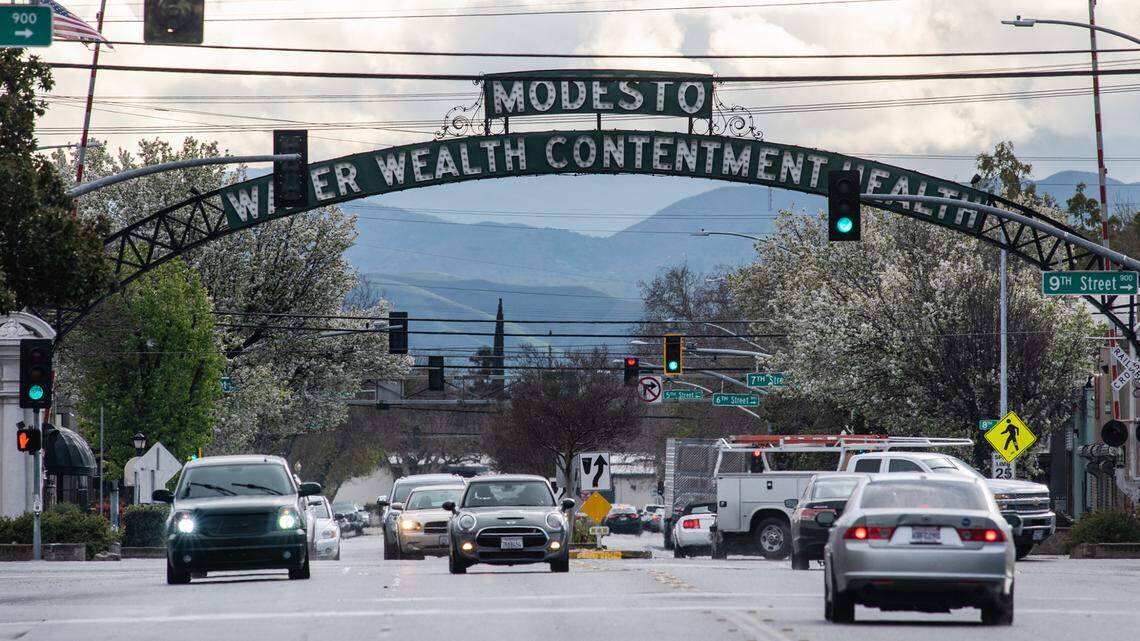 Looking west at the Modesto arch from I Street on a rainy day in downtown Modesto, Calif., on Wednesday, March 10, 2021.