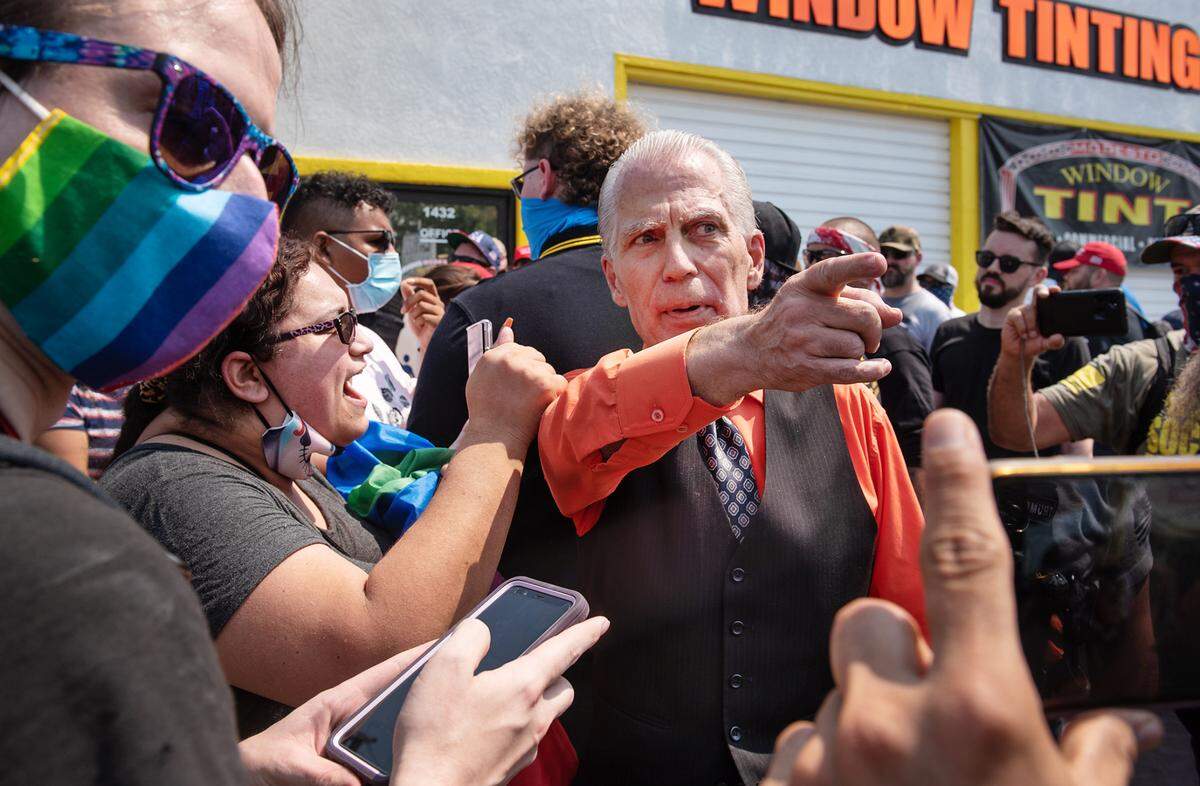 Straight Pride organizer Don Gurndmann is confronted by counter-protesters during a straight pride rally that brought militia members and the Proud Boys to Modesto, Calif., on Saturday August 29, 2020.