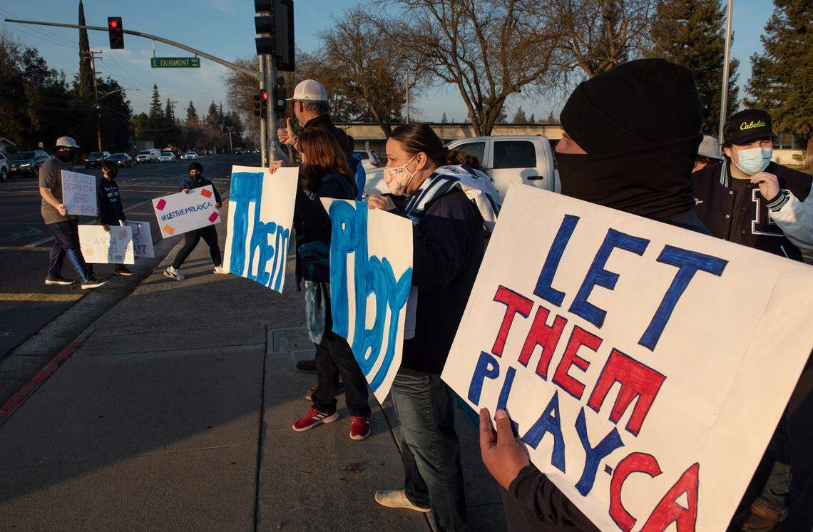 High school athletes and their parents held a rally at Downey High School in Modesto in support of easing COVID-19 restrictions on their sports in Modesto, Calif., on Friday, Jan. 15, 2021.