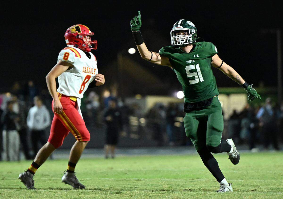 Manteca’s Isiah White celebrates a sack on Oakdale quarterback Grant Gardner during the Valley Oak League game at Manteca High School in Manteca, Friday, Nov. 1, 2024.