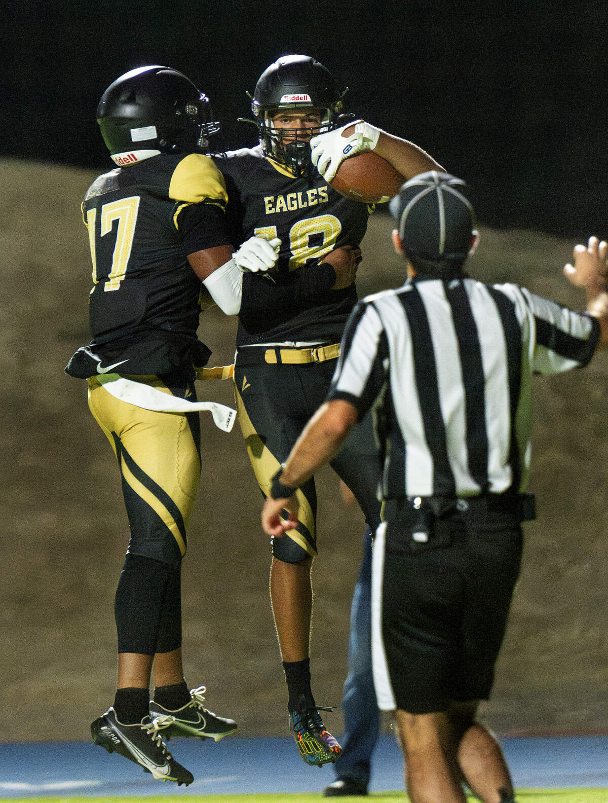 Enochs’ Anthony Brown (18) and Brennan Whitten Jr (17) celebrate a touchdown during the game with Beyer at Downey High School in Modesto, Calif., Friday, Aug. 23, 2024.