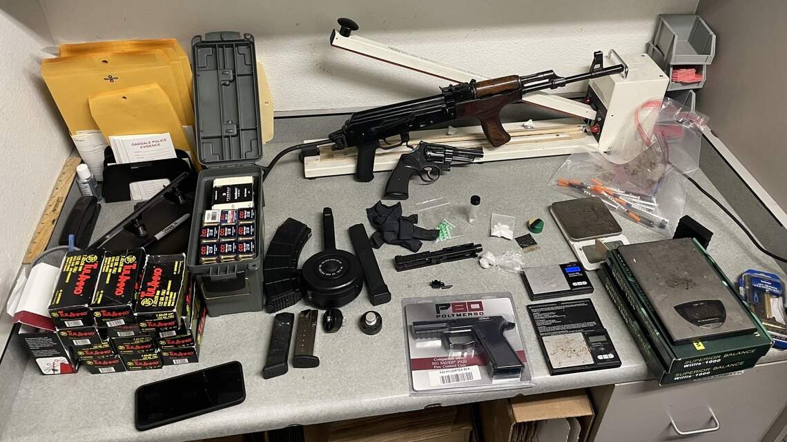 Police find drugs and illegal firearms in search of Oakdale home. Two men arrested.