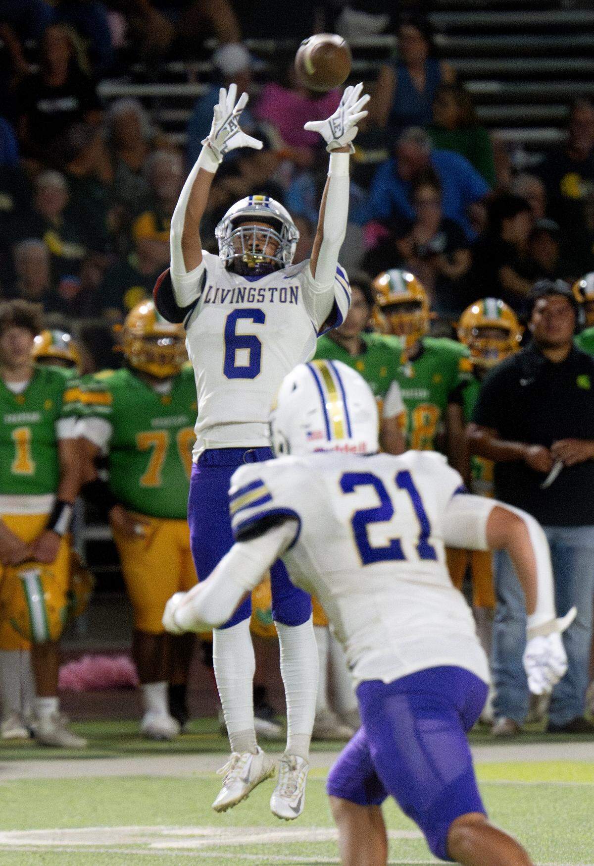 Livingston’s Luis Sandoval (6) makes a catch during the Western Athletic Conference game with Grace Davis at Downey High School in Modesto, Calif., Thursday, Oct. 3, 2024.
