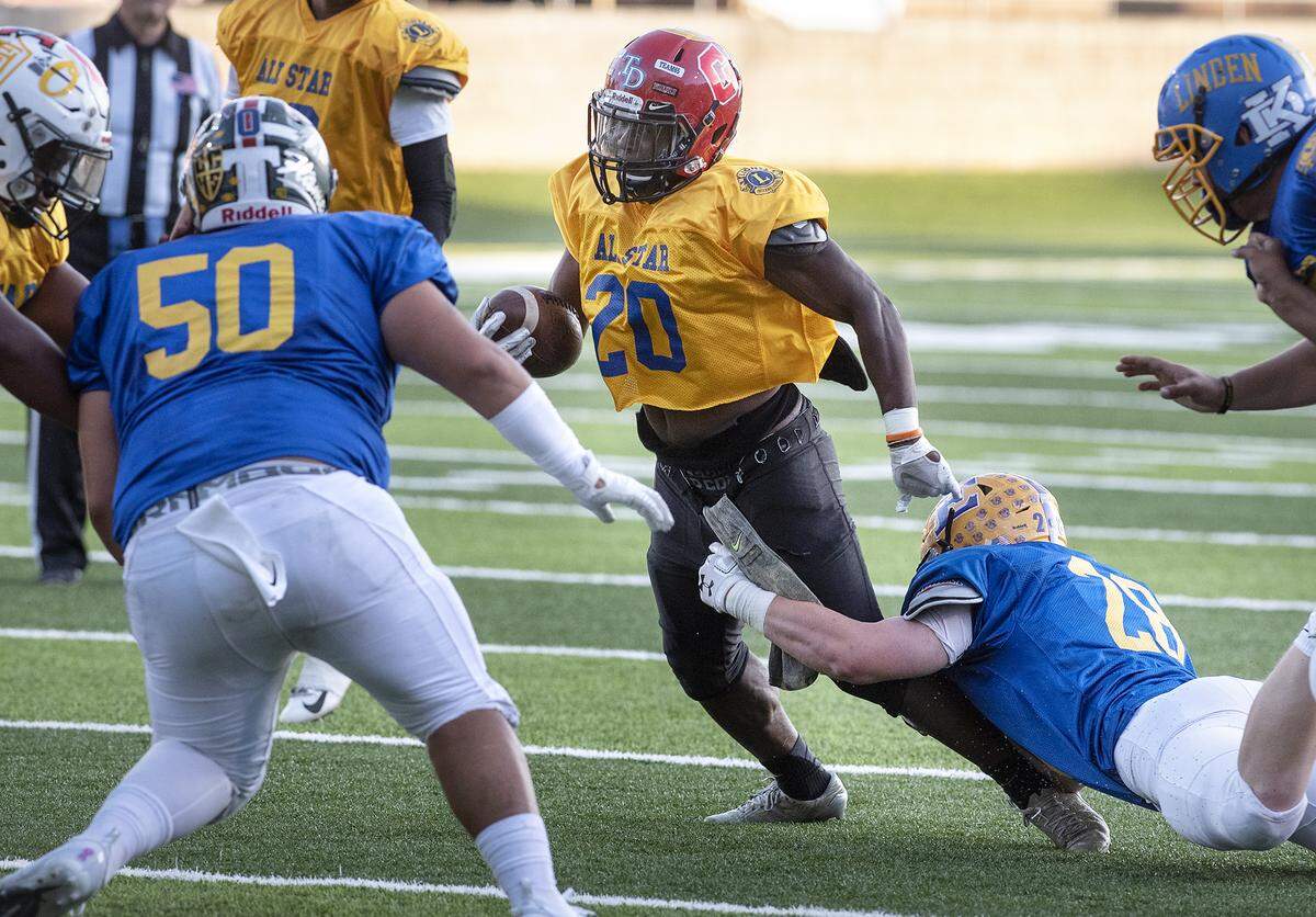 South’s Zaire Eugene (Modesto) runs the ball during the Central California Lions All-Star Football game at Lincoln High School in Stockton, Calif., Saturday, June 15, 2019.