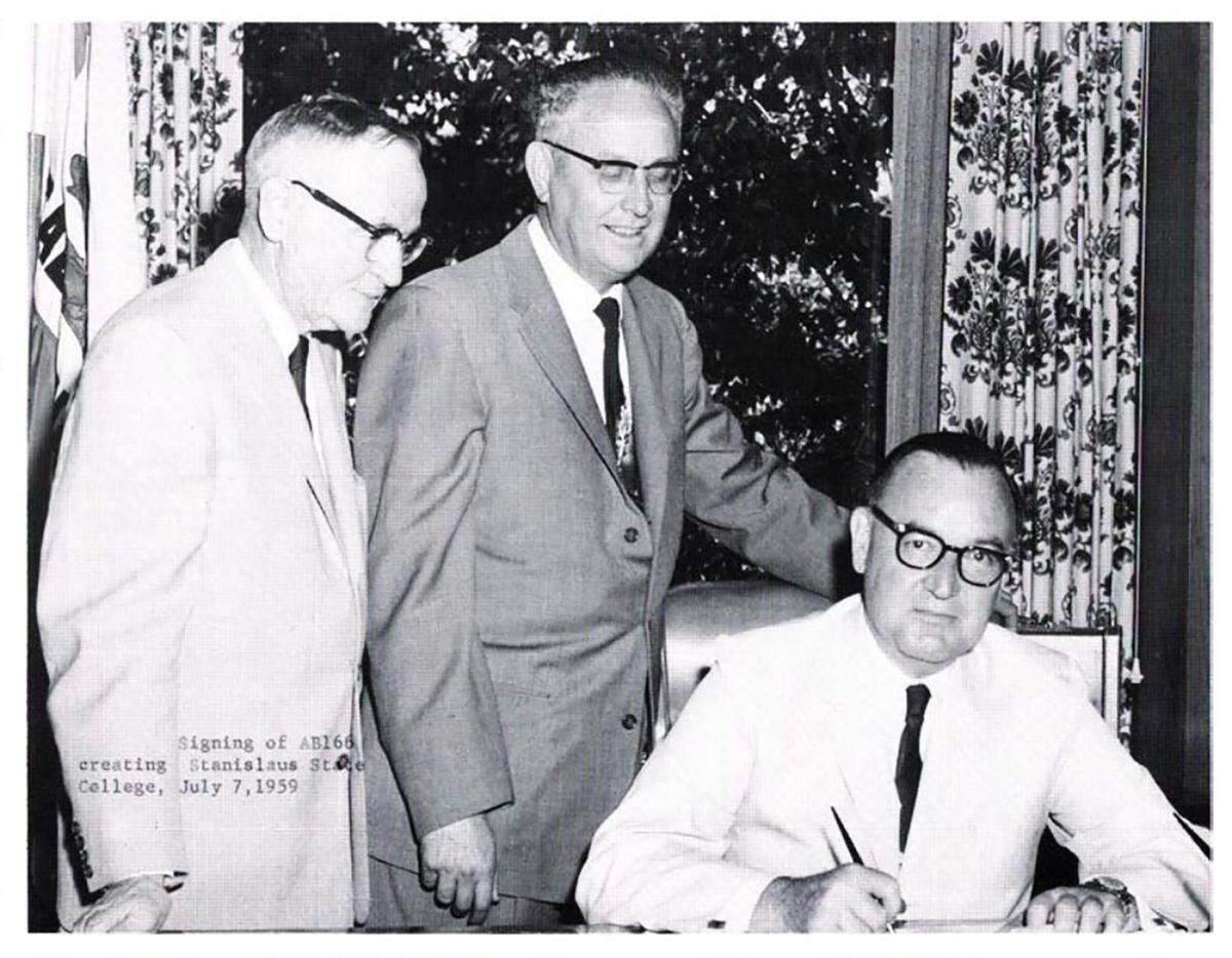 Assemblyman Ralph M. Brown and state senator Hugh P. Donnelly of Turlock with Governor Edmund Brown in 1959 signing AB 166, establishing Stanislaus State College.
