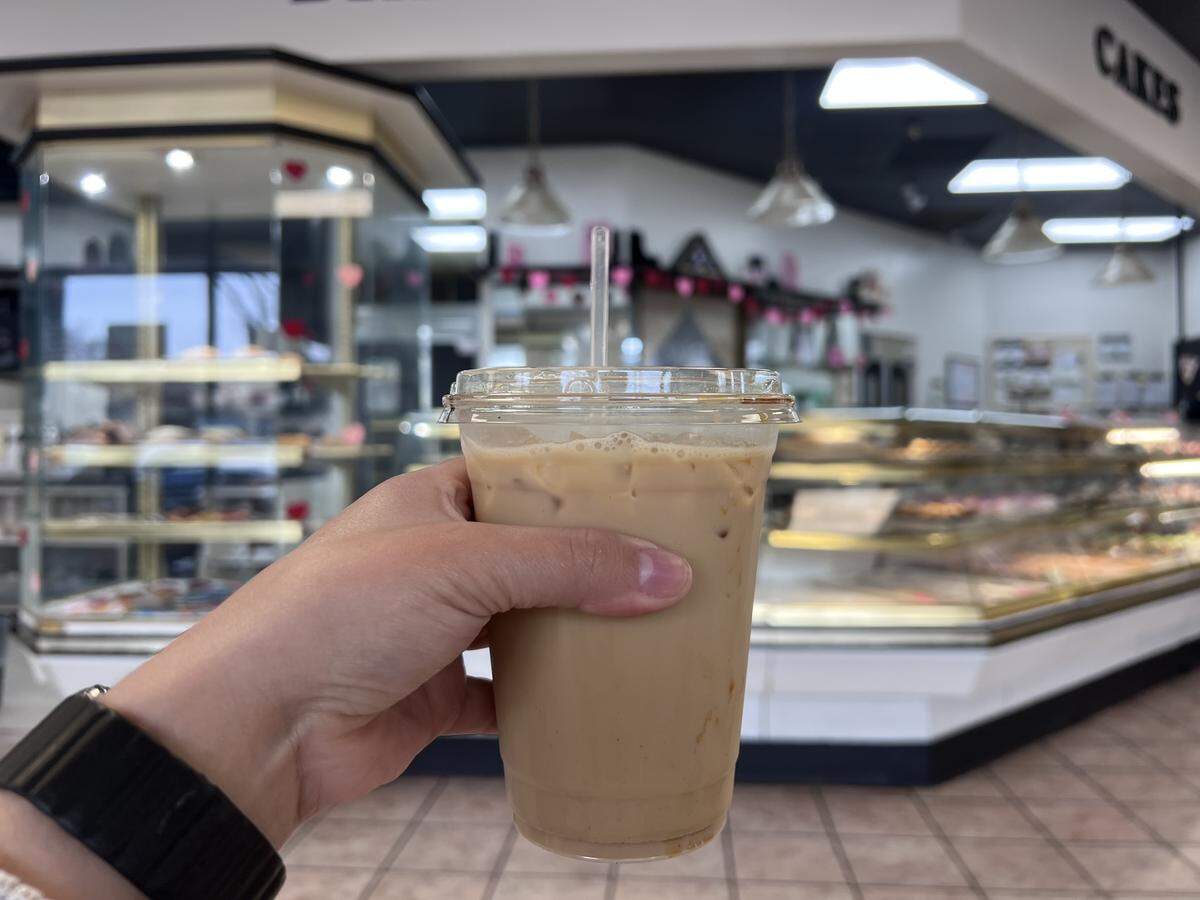 The beverage menu includes hot and iced coffee and tea options, ranging from a simple espresso shot to an iced pineapple matcha.