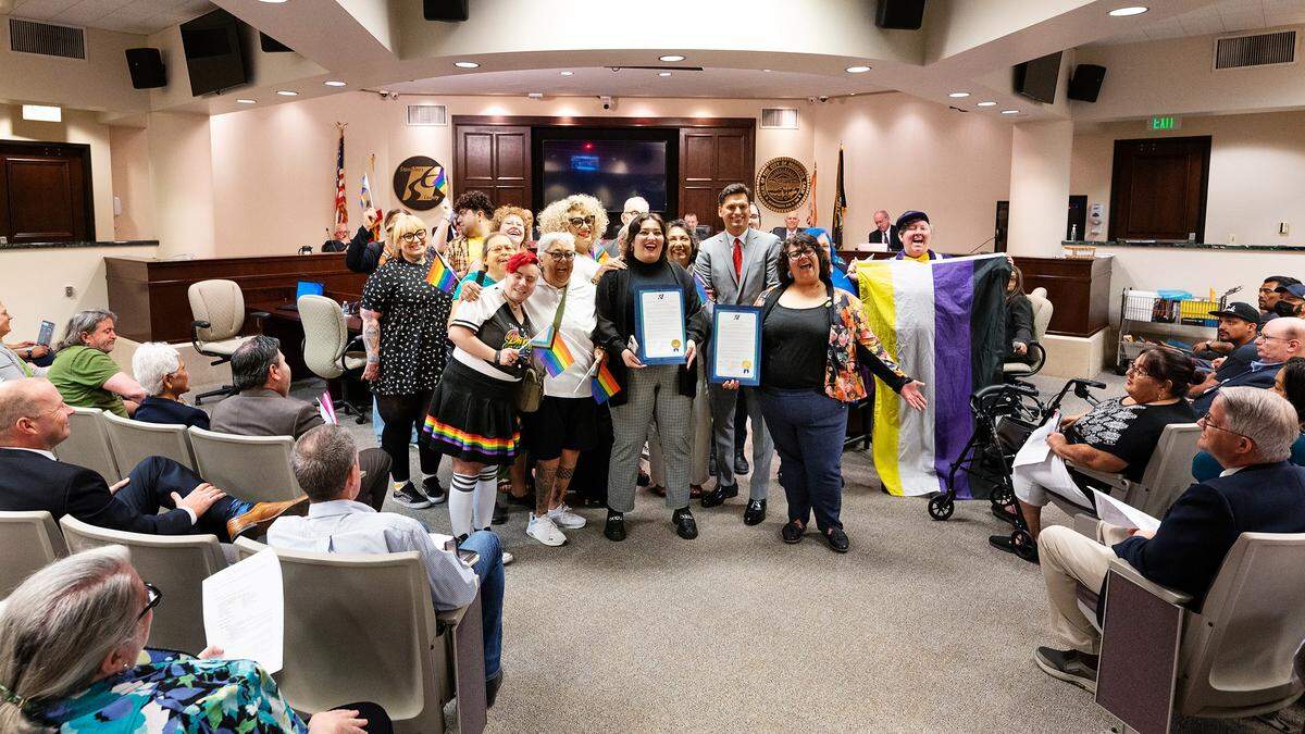 Members of the LGBTQ+ community pose for pictures as supervisors proclaimed June 2023 as Pride Month in Stanislaus County during a board meeting in Modesto, Calif., Tuesday, June 6, 2023.