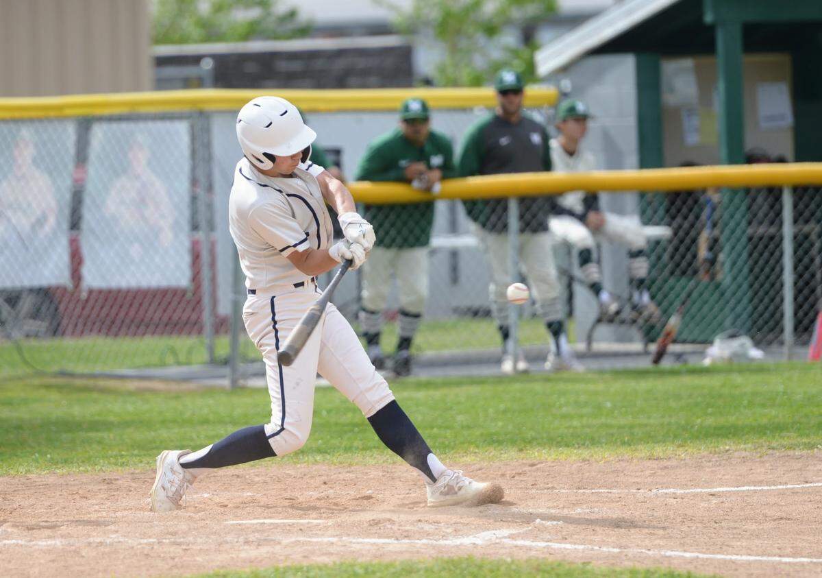 Central Catholic’s AJ Miligi hits a pitch during a Valley Oak League matchup with Manteca at Manteca High School on Friday, April 26, 2024.