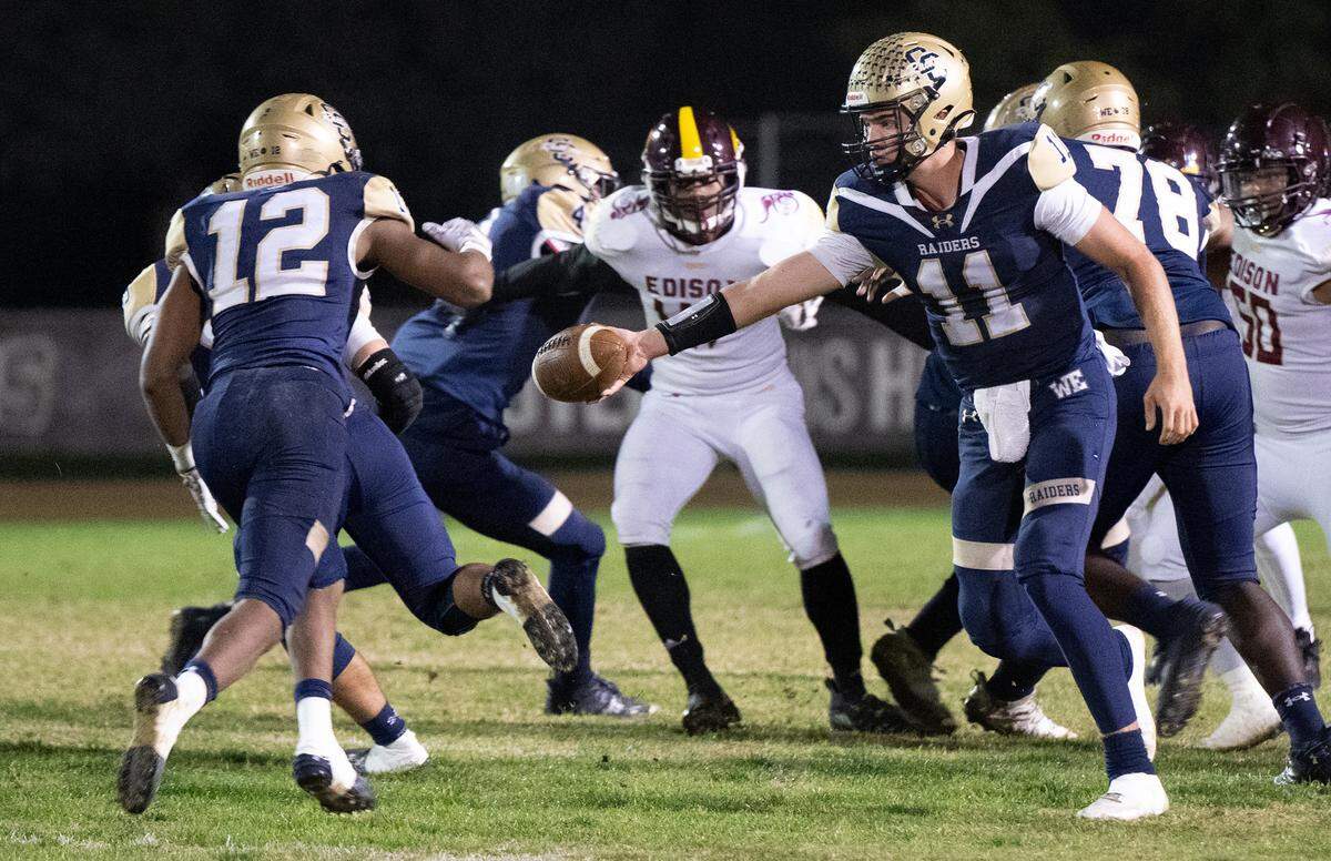 Central Catholic’s Joey Alcutt (12) takes the handoff from quarterback Tyler Wentworth during the Sac-Joaquin Section Division I semifinal game with Edison at Central Catholic High School in Modesto, Calif., Friday, Nov. 10, 2023.