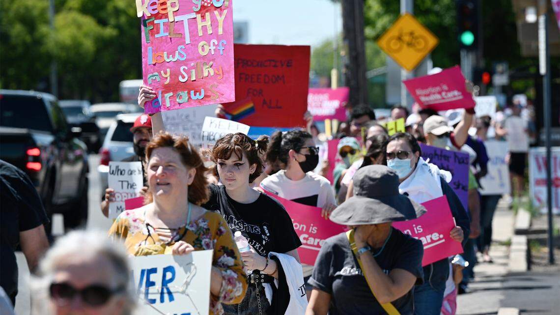 Participants march down McHenry Avenue in Modesto as hundreds rally for abortion rights on May 14.