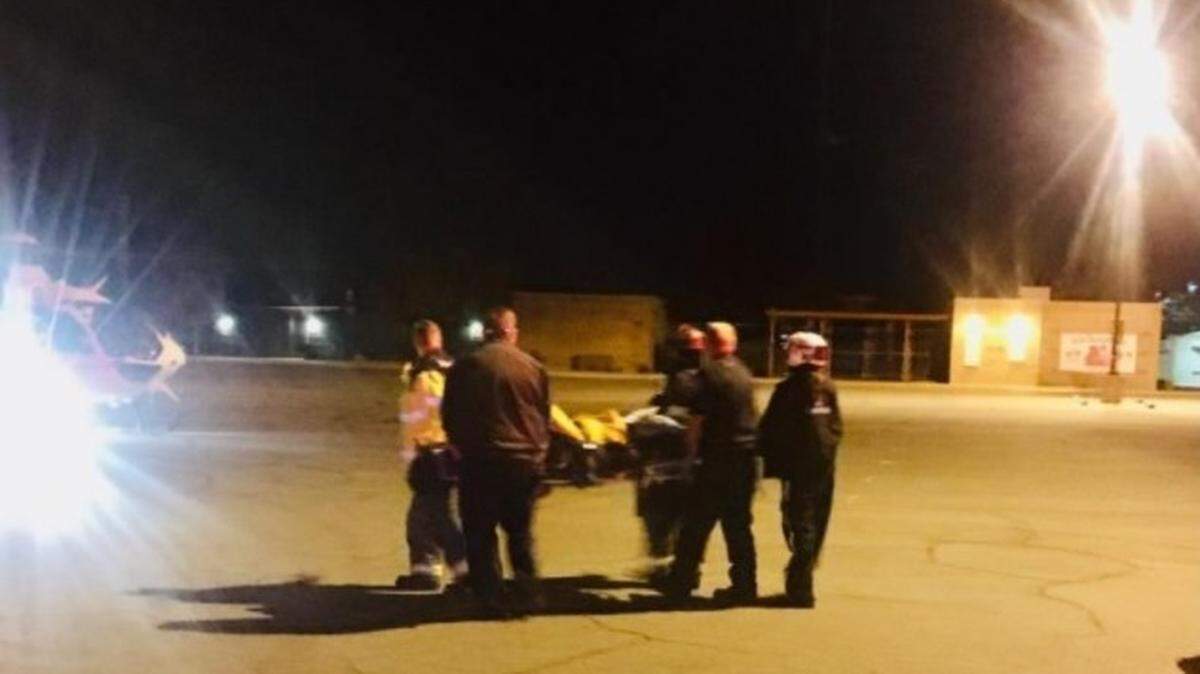 A burn victim is taken to a helicopter that landed at John Thurman Field in Modesto on Monday evening, Dec. 7, 2020.