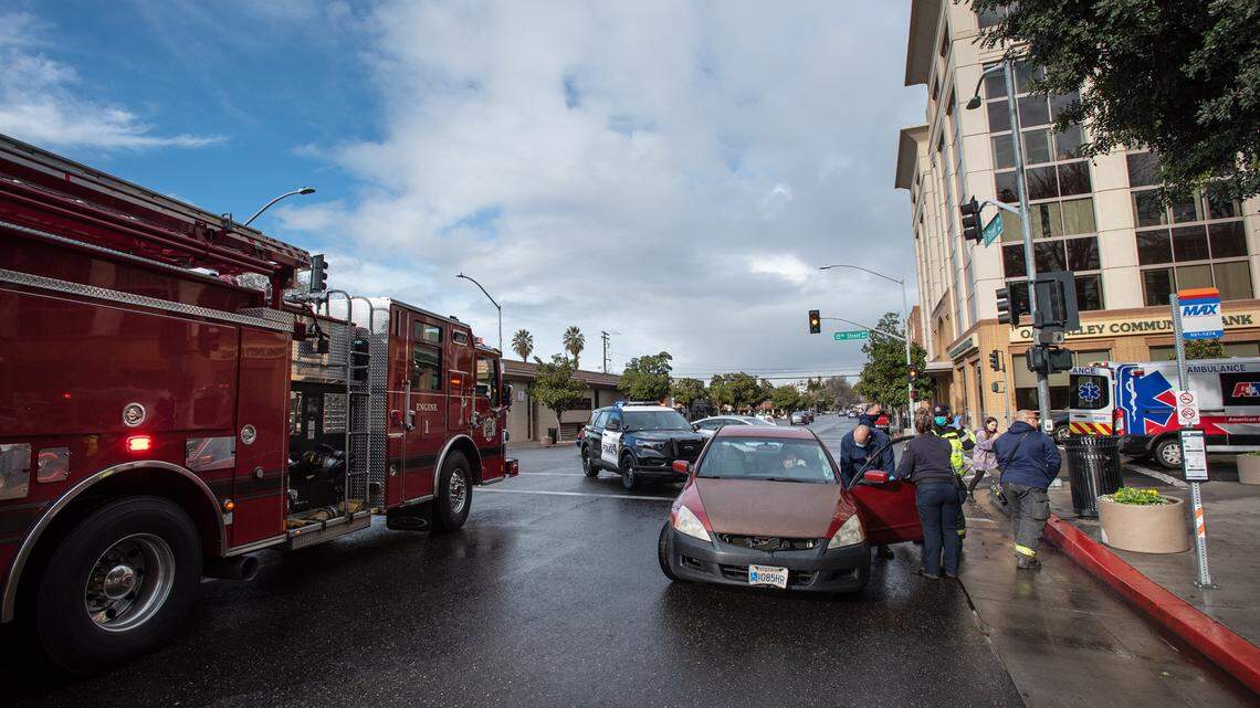 Modesto Fire attend to an accident victim on I Street in downtown Modesto, Calif., on Wednesday, March 10, 2021.