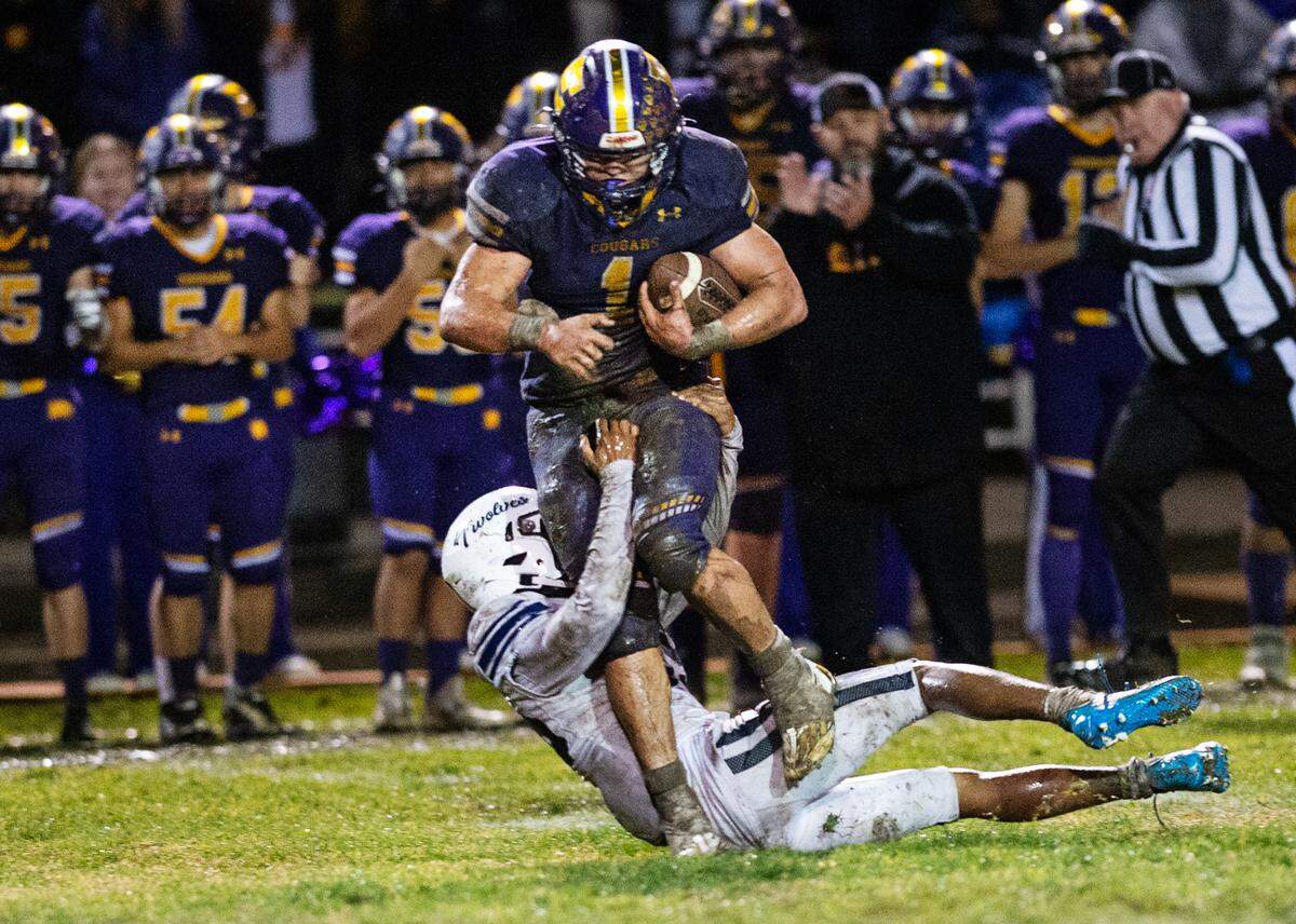 Escalon’s Ryker Peters runs the ball during the CIF State Division 4-AA Football Championship game with Northwood in Escalon, Calif., Saturday, Dec. 10, 2022.