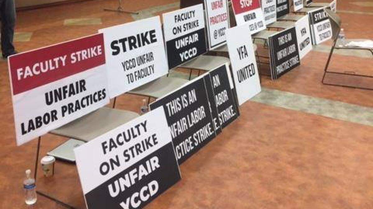 Signs are pictured from the Yosemite Faculty Association General Faculty Meeting held Nov. 16, 2018, at the Gene Bianchi Community Center in Oakdale.