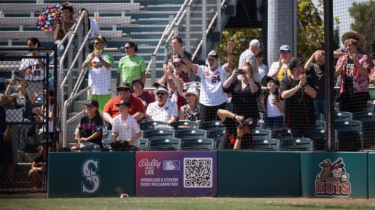 Fans cheer the home run of Nuts player Connor Dykstra during the final game at John Thurman Field in Modesto, Sunday, Aug. 31, 2025.