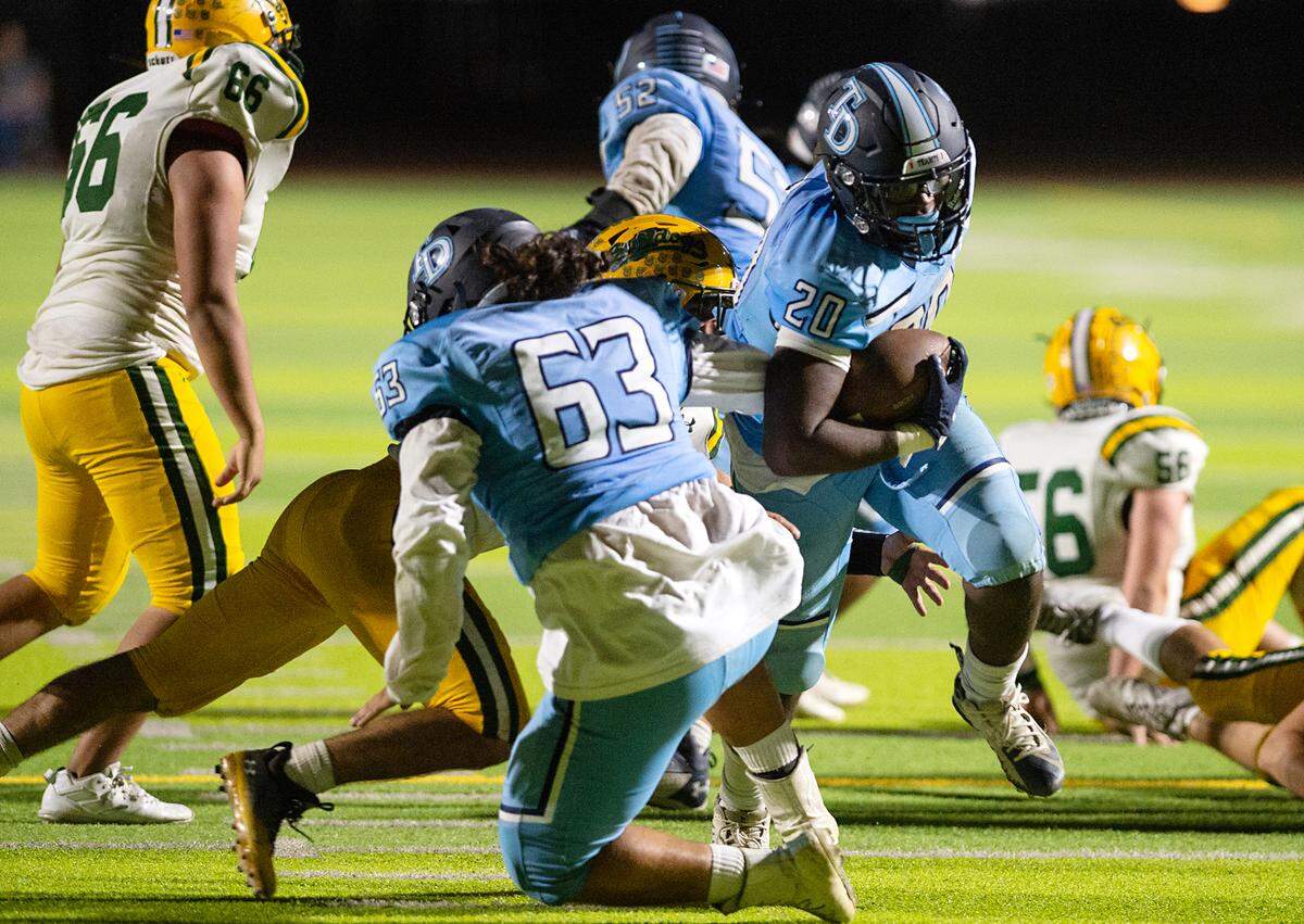 Downey’s Ki Ragland scores on a short touchdown run during the nonleague game with Tracy at Downey High School in Modesto, Calif., on Friday, September 16, 2022. Downey won the game 24-13.