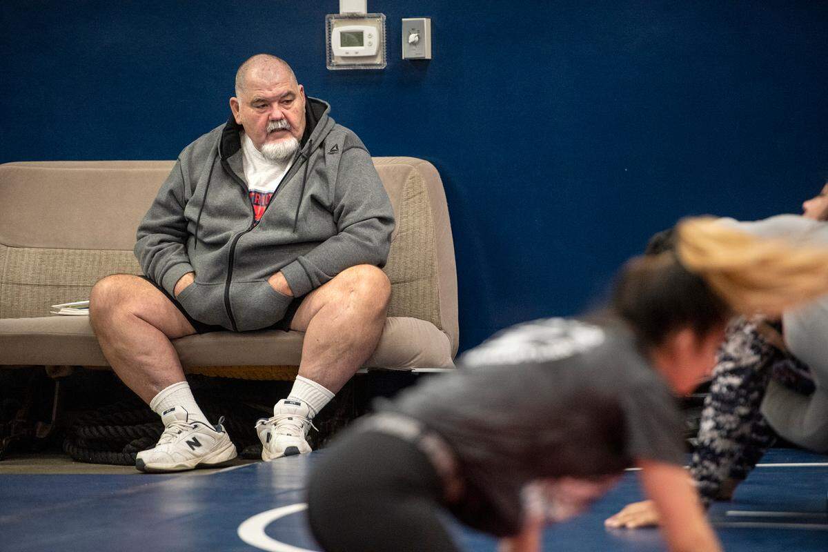 Head coach Doug Severe watches his wrestling team practice at Beyer High School in Modesto, Calif., on Monday, Dec. 20, 2021.