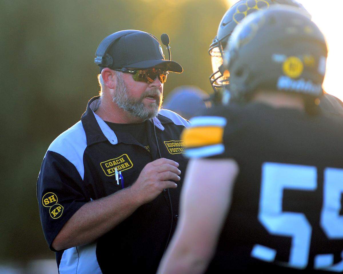 Hughson Head Coach Shaun King talks to his players during a game between Hughson High School and Central Valley High School at Hughson High School in Hughson California on August 25, 2023.