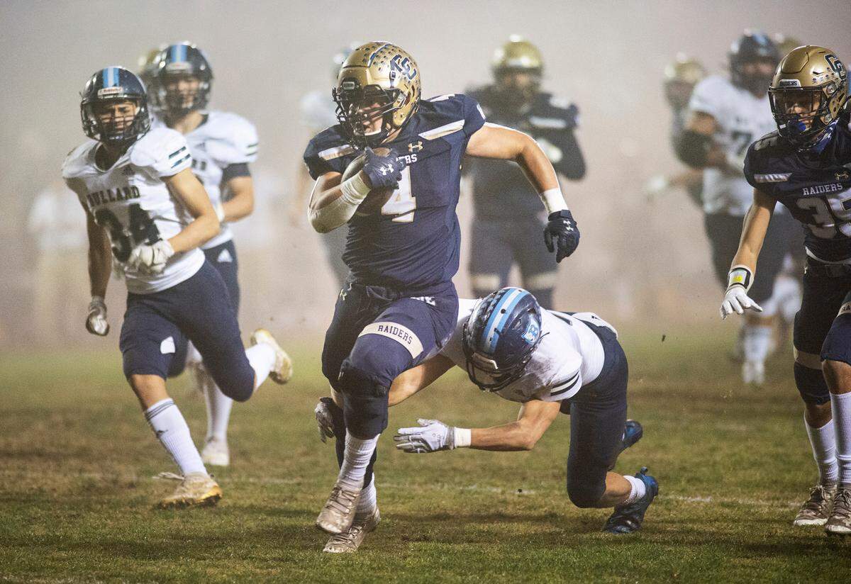 Central Catholic’s Julian Lopez escapes Bullard defenders on a run during the CIF Division II Northern California Regional Championship game at Central Catholic High School in Modesto, Calif., Dec. 3, 2021.