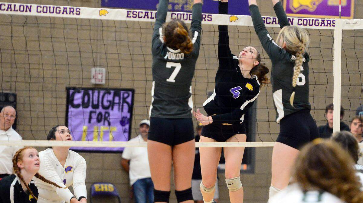 Escalon’s Gianna Bava (4) reaches out to hit the ball during a CIF San-Joaquin Division III Girls Volleyball Playoffs game between Escalon High School and Ponderosa High School at Escalon High School in Escalon CA on November 1, 2022. Escalon won the match 3-2.