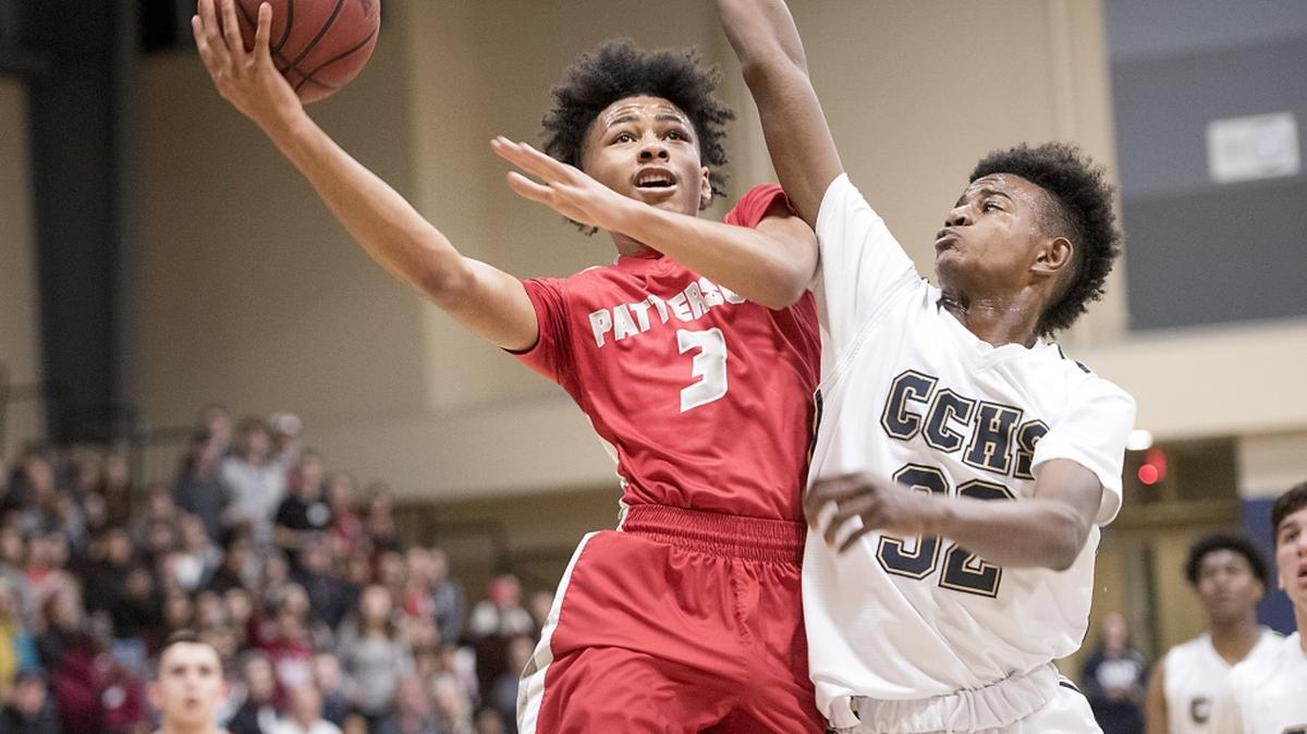 Patterson's Kwaheri Rue scores past Central Catholic's Myles Clayton during the Sac-Joaquin Section Division III tournament semifinal game at Central Catholic High School in Modesto, Calif., on Wednesday, Feb. 28, 2018. Central won game the game 54-49.