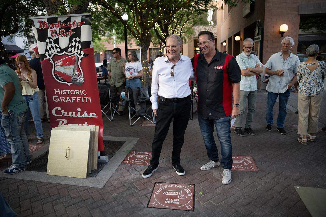 The Legends of the Cruise Walk of Fame Ceremony honored the “Racers of the Graffiti Era,” and inducted eight new members including Allen Beebe, left, seen here with host Chris Murphy, right, in Modesto, Wednesday, June 4, 2025.