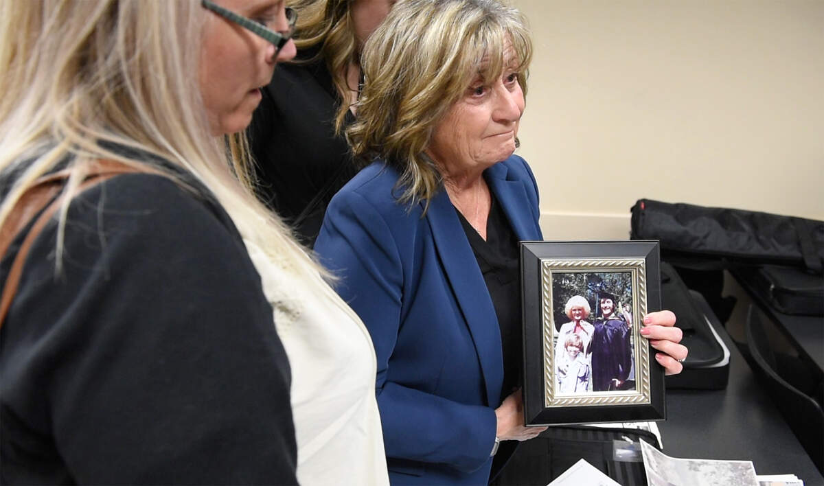 Sandy Ranzo-Howell shows a picture of her brother Phillip Ranzo the day he graduated from pharmacology school at the University of the Pacific in 1976. He is pictured with his wife, Kathy, and son, Mark. In 1979 when Mark was 10 years old, his parents were murdered in their Modesto home.