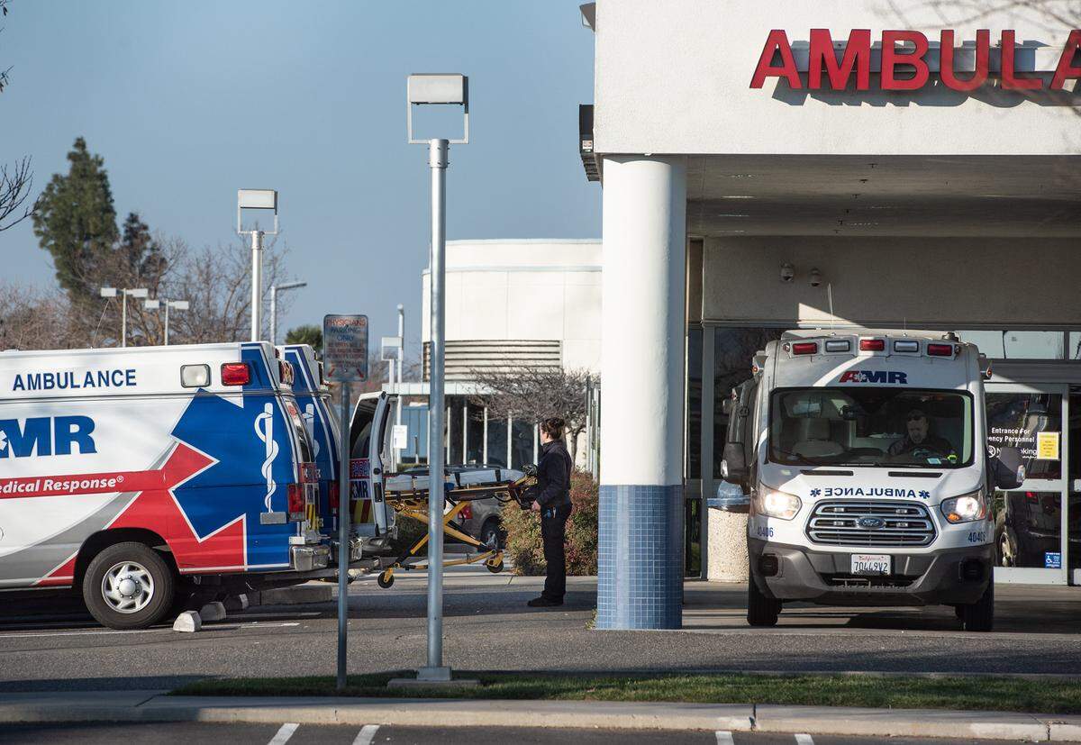 AMR ambulances are parked outside the emergency department at Sutter Memorial Medical Center in Modesto, Calif., on Tuesday, Jan. 25, 2022.