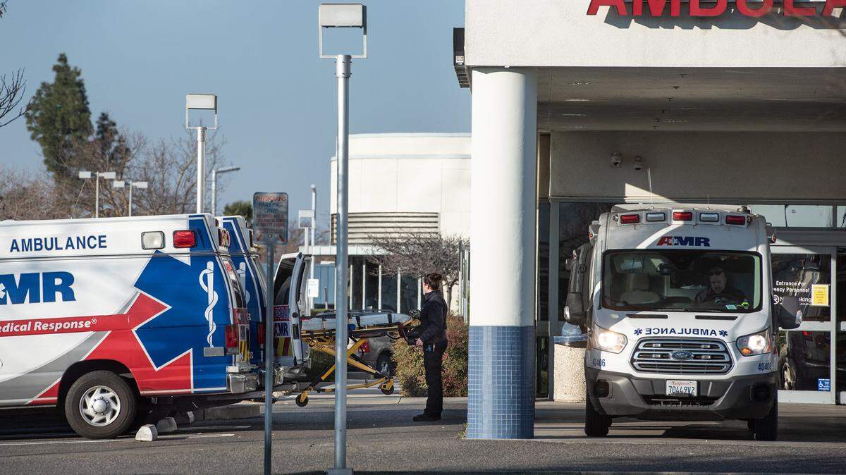 AMR ambulances are parked outside the emergency department at Sutter Memorial Medical Center in Modesto, Calif., on Tuesday, Jan. 25, 2022.
