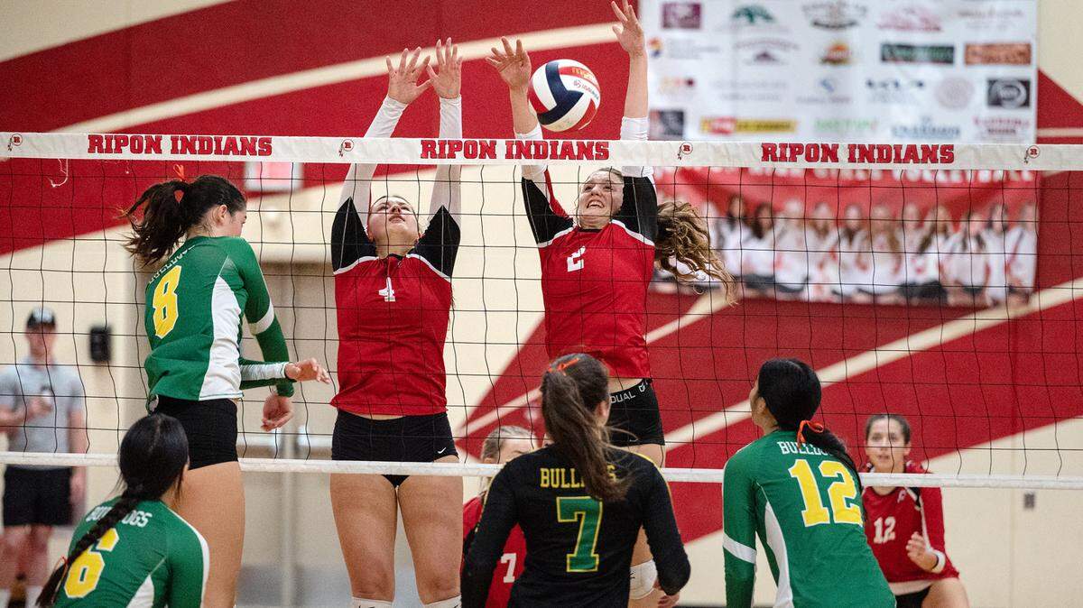 Ripon’s Makenzie Loechler (2) and Avery McKiernan (4) block the shot of Tracy’s Chloe Lemons (8) during a non-league match in Ripon, Calif., on Thursday, September 22, 2022. Tracy won the match 3-2.