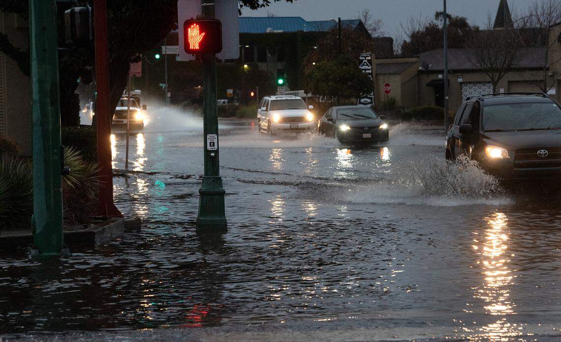 Needham Street at College Avenue was overwhelmed by rainwater in Modesto, Calif., Saturday, Dec. 10, 2022.