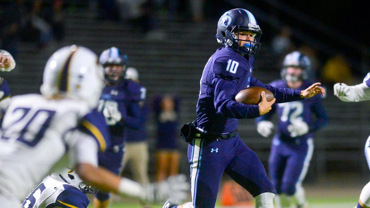 Downey quarterback Bryce Gouker (10) runs downfield during a game between Downey and Gregori at Downey High School in Modesto, CA on October 18, 2019.