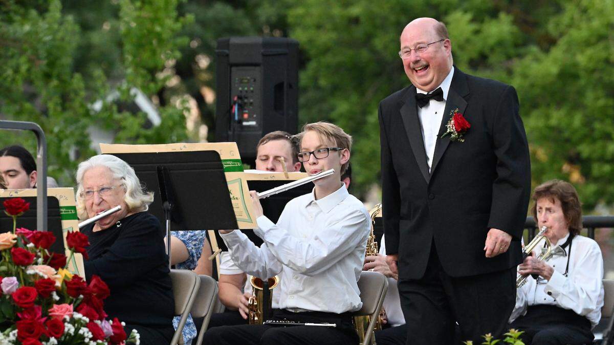 George Gardner takes the stage in his final performance as conductor of MoBand at Mancini Bowl in Graceada Park in Modesto, Calif., Thursday, July 11, 2024.