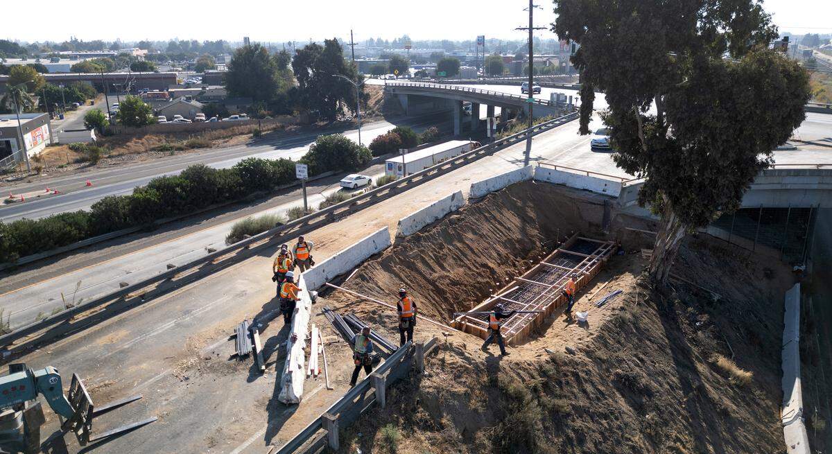 A California Department of Transportation crew is building a retaining wall on the southbound Highway 99 off-ramp at Hatch Road in Ceres, Calif., Tuesday, Sept. 24, 2024. Work is expected to be finished by Sept. 30.