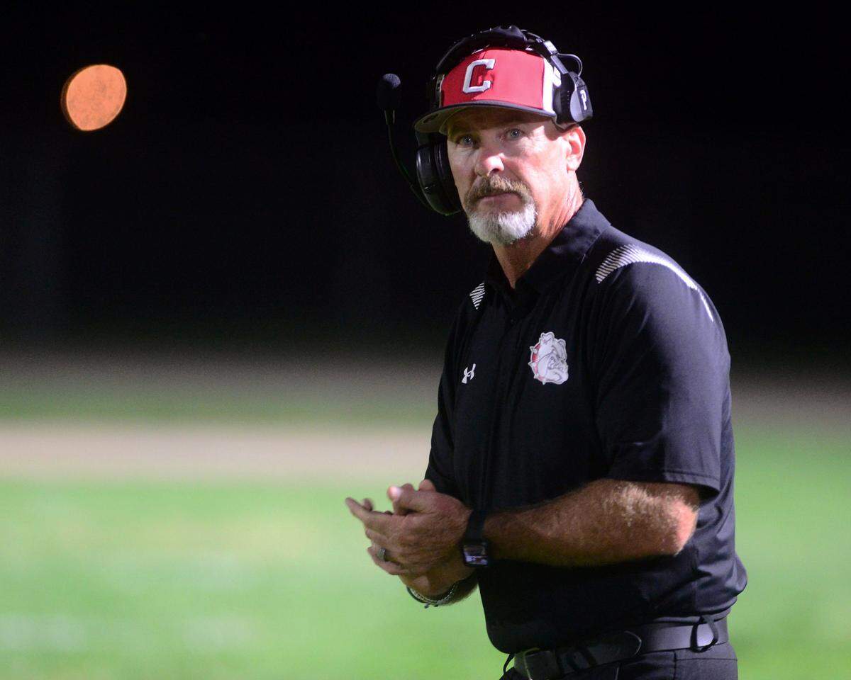 Ceres Head Coach Brett Johnson looks toward toward the scoreboard during a game between Ceres High School and Pacheco High School at Ceres High School in Ceres California on October 7, 2022.