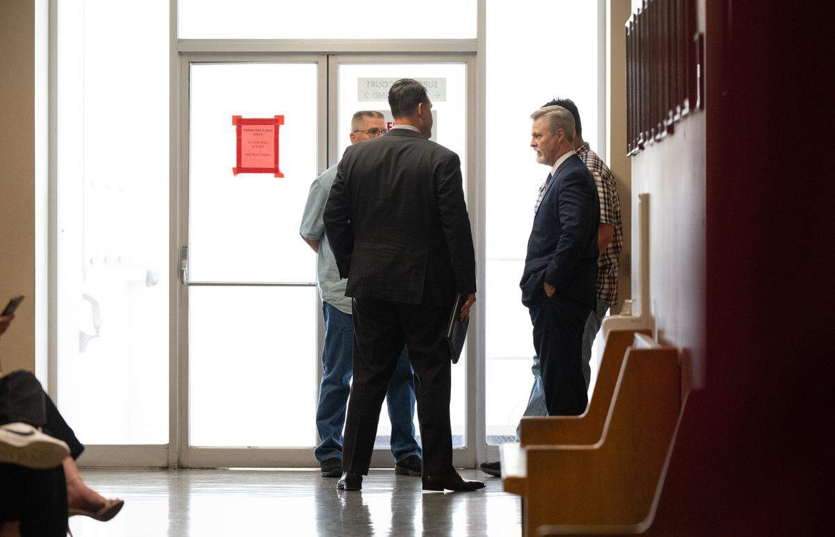 Attorney Roger Wilson, right, talks with former Modesto Police officer Joseph Lamantia at the Stanislaus County courthouse in Modesto, Calif., Friday, July 21, 2023. Judge Carrie Stephens cleared Lamantia in the fatal shooting of Trevor Seever.