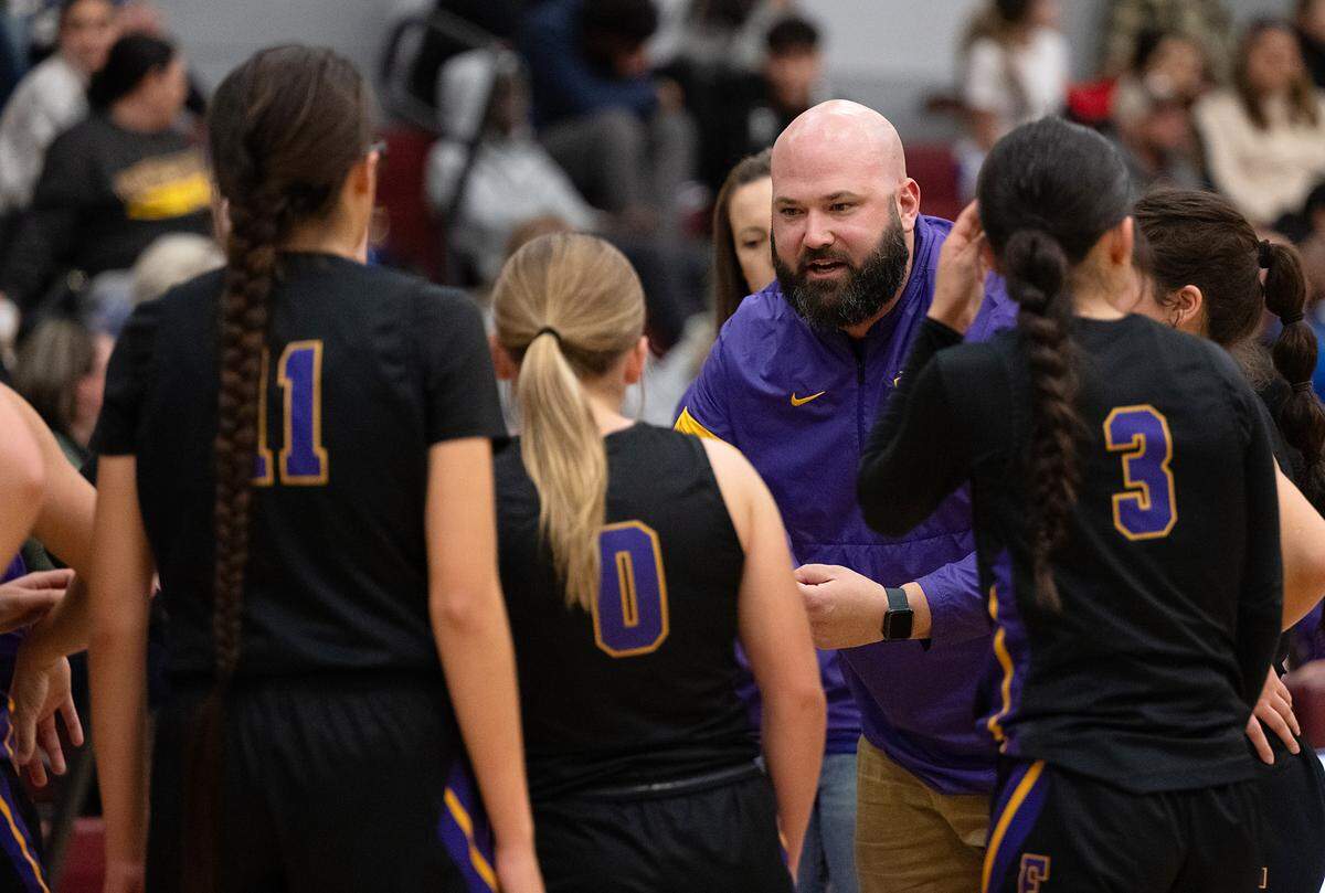 Escalon coach Joe Dalpogetti talks with his players during a timeout in the Trans Valley League game with Riverbank at Riverbank High School in Riverbank, Calif.,Thursday, Jan. 4, 2024.