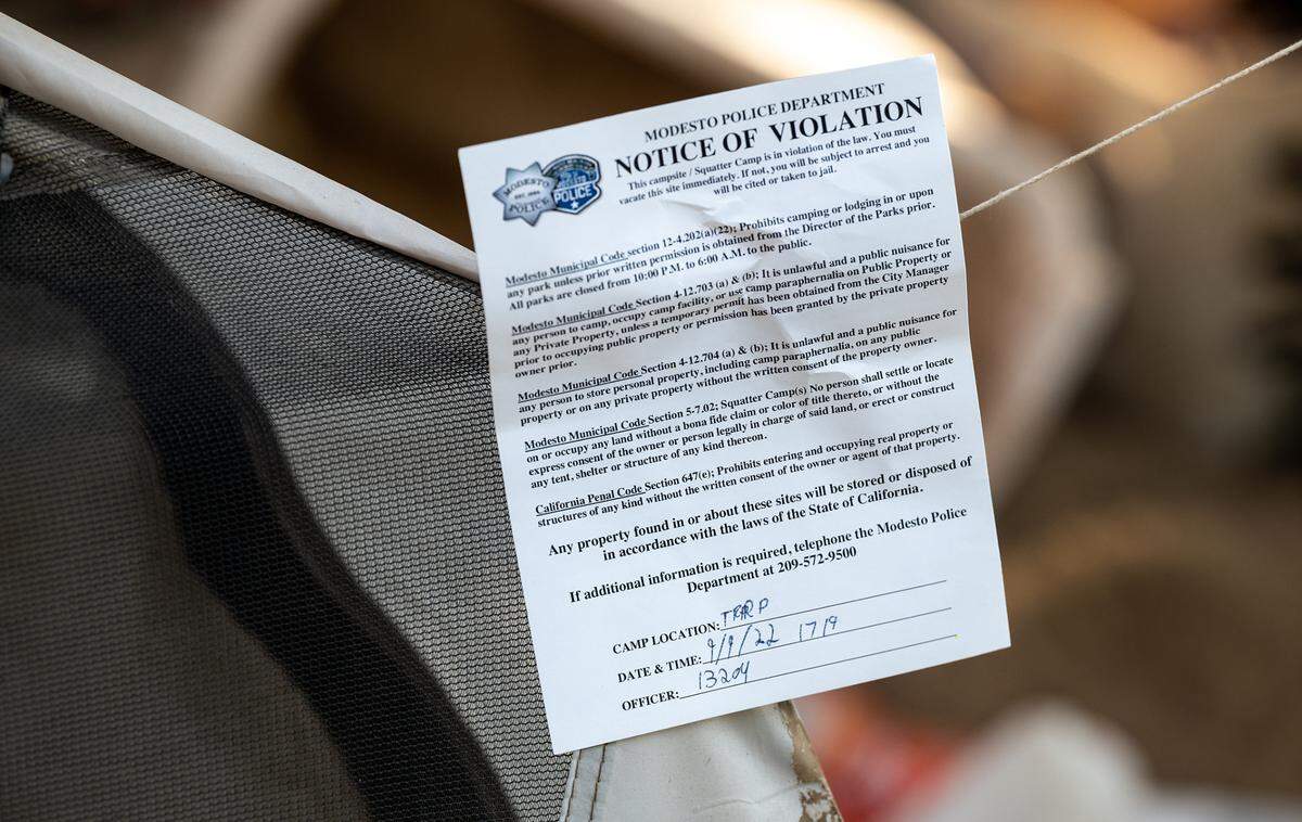72-hour notice to vacate an illegal campsite along the Tuolumne River in Tuolumne Regional Park in Modesto, Calif., on Friday, September 9, 2022.