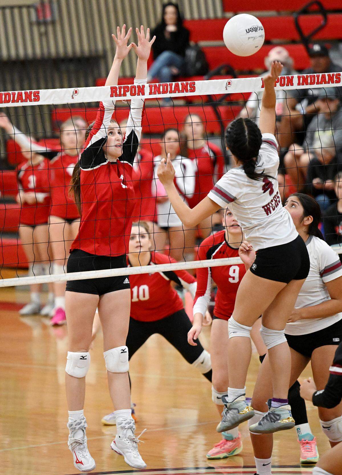 Ripon’s Olivia Neuman attempts a block on West Campus’ Emily Lee during the Division IV semifinal playoff match at Ripon High School in Ripon, Calif., Tuesday, Oct. 31, 2023.