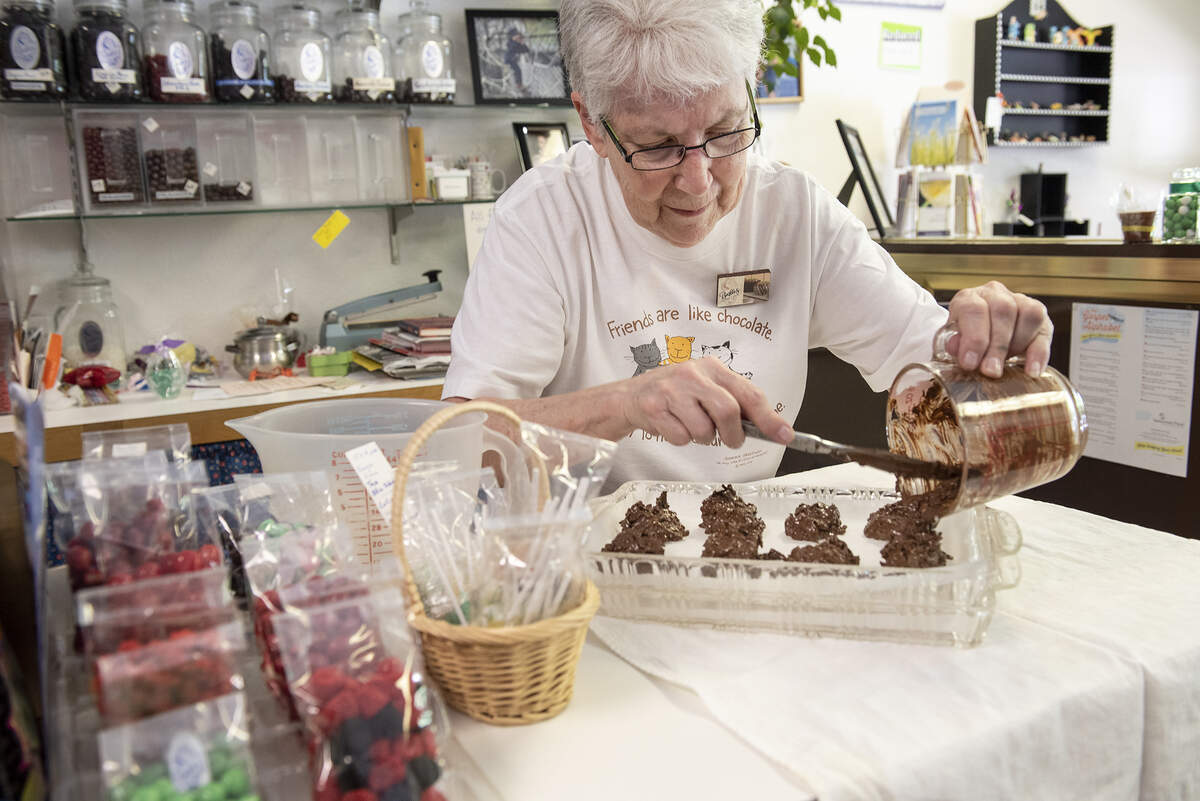 Eddi Marie Julian, owner of Beckles Candies, makes haystacks at her store in Modesto, Calif., Saturday, June 15, 2019. Julian is closing her downtown store after more than 30 years in business.