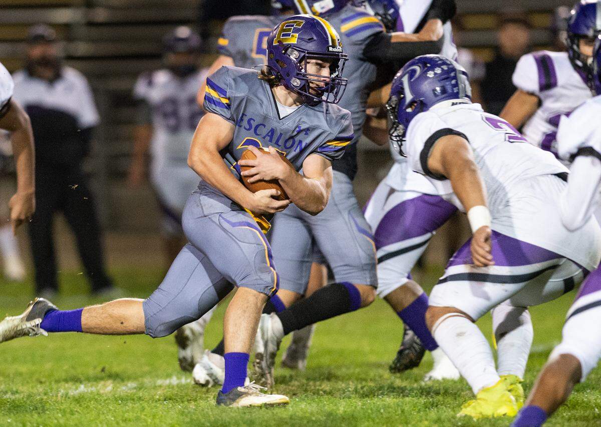 Escalon’s Ayden Wilson runs the ball during the first round playoff game with Pacheco in Escalon, Calif., Friday, Nov. 4, 2022.