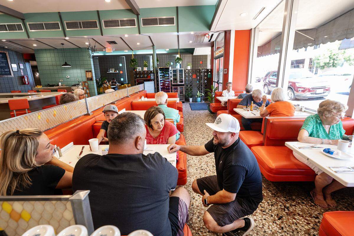 Owner Nick Pedretti, right, talks with Michael and Michele Fernandes, their son Paxton, 4, and Virginia Vitoria at Latif’s restaurant in Turlock, Calif., Tuesday, August 29, 2023.