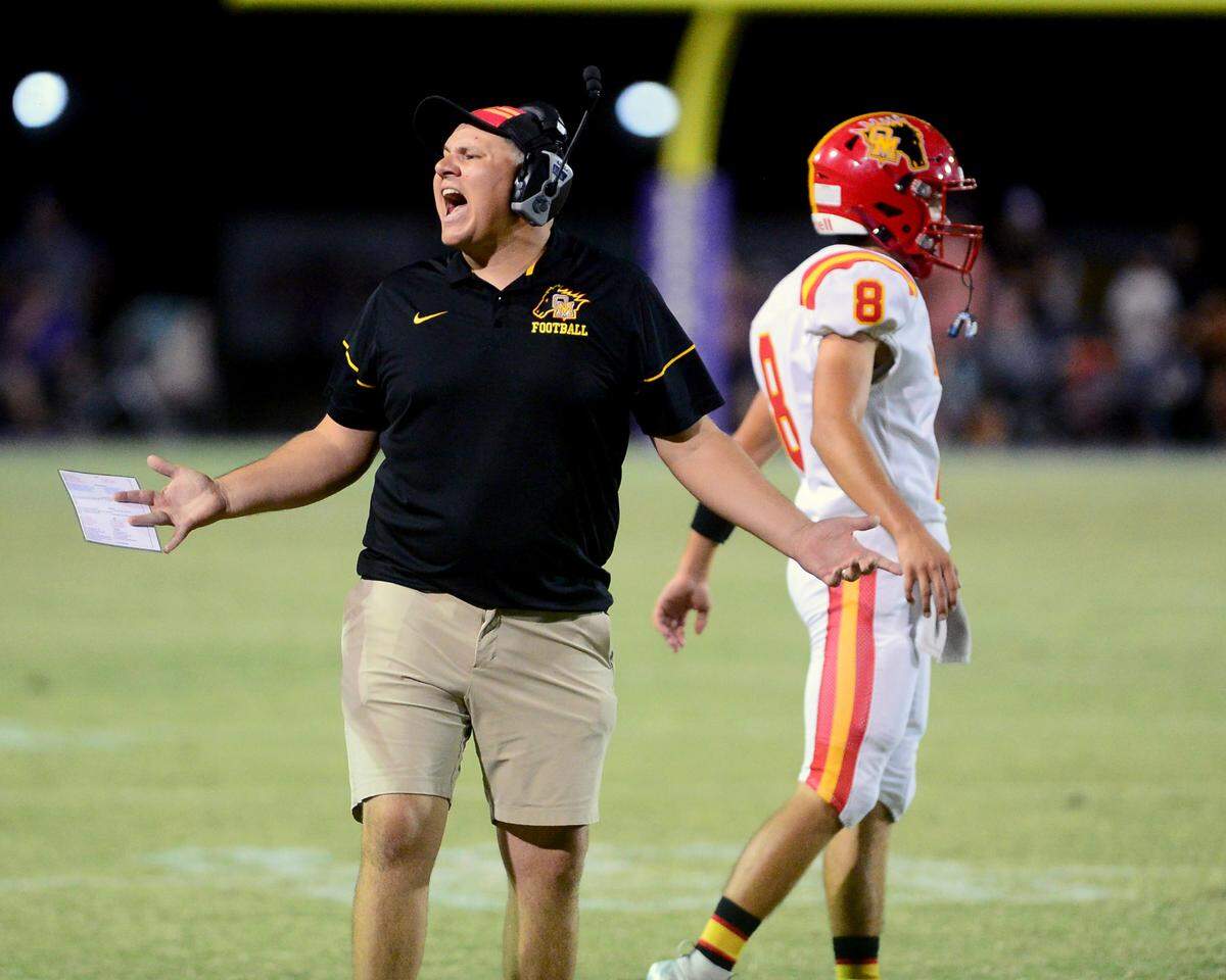 Oakdale Head Coach Garrett Martin yells to the sideline during a game between Escalon High School and Oakdale High School in Escalon, Calif. on Sept. 6, 2024. Oakdale won the game 21-20 in overtime.