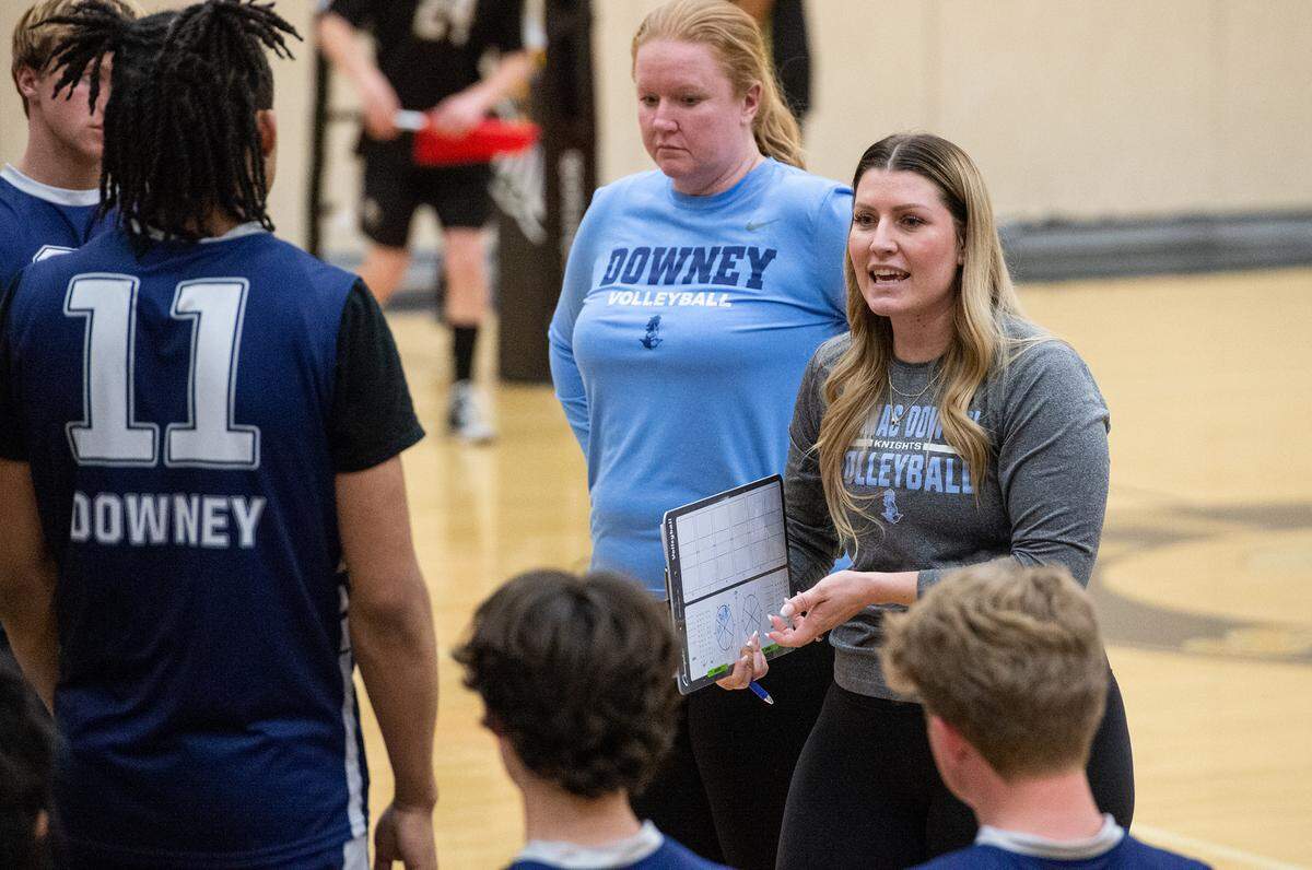 Downey coach Tera Coleman talks with her team during the Central California Athletic League match with Enochs at Enochs High School in Modesto, Calif., Tuesday, April 4, 2023.