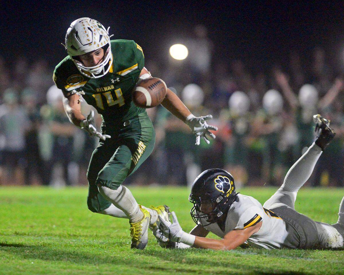 Hilmar running back Luis Vargas (14) reaches out to recover the ball on a fumble during a game between Hughson High School and Hilmar High School at Hughson High School in Hughson CA on October 14, 2022.