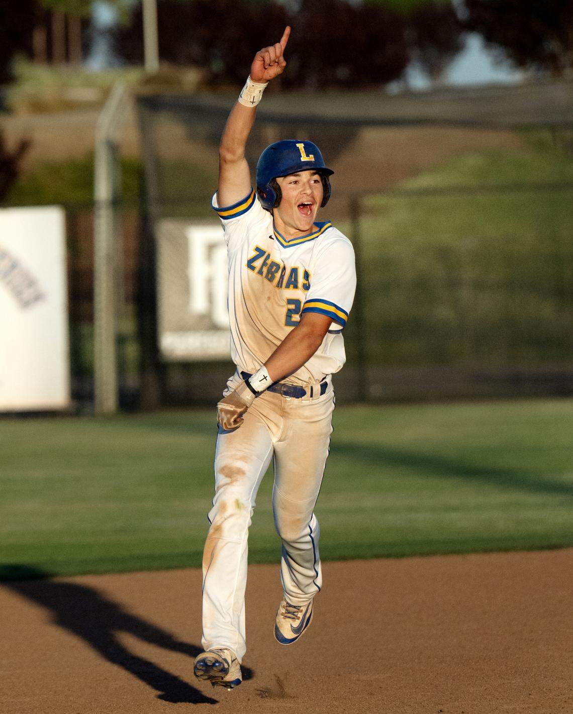 Lincoln’s Dylan Knell rounds the bases after a home run to give the Zebras the lead in the Sac-Joaquin Section D-V championship game with Hughson at Islander’s Field in Lathrop, Wednesday, May 21, 2025. Lincoln won the game 6-5.